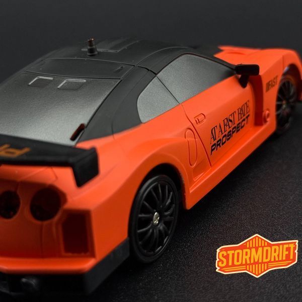 Игрушечная машинка Nissan GT-R оранжевая для дрифта на радиоуправлении 4WD HB Toys 959 фото